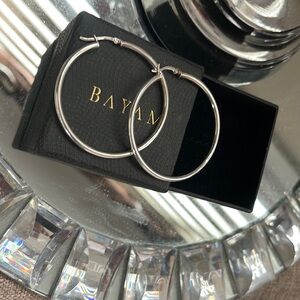 Sterling Silver hoop earrings.